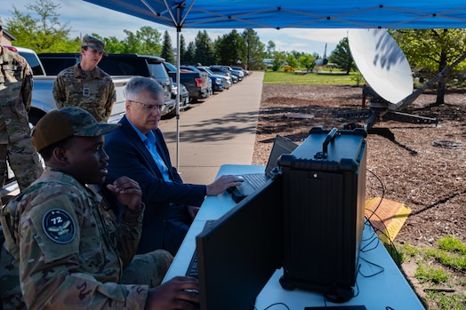  Secretary of the Air Force Troy Meink joins in an operations demonstration with U.S. Space Force Spc. 3 Jeremiah Blount of Space Delta 7 (Intelligence, Surveillance, Reconnaissance and Targeting) at Peterson Space Force Base, Colorado, May 28, 2025. Space Operations Command Guardians and Airmen demonstrated their combat readiness and warrior ethos, providing Meink with a deep dive into multiple critical mission areas, to include Space Domain Awareness; Electromagnetic Warfare; Missile Warning; Intelligence, Surveillance, Reconnaissance and Targeting; Orbital Warfare and Positioning, Navigation and Timing; as well as the critical mission support provided by the U.S. Air Force.  (U.S. Space Force photo by Dave Grim)