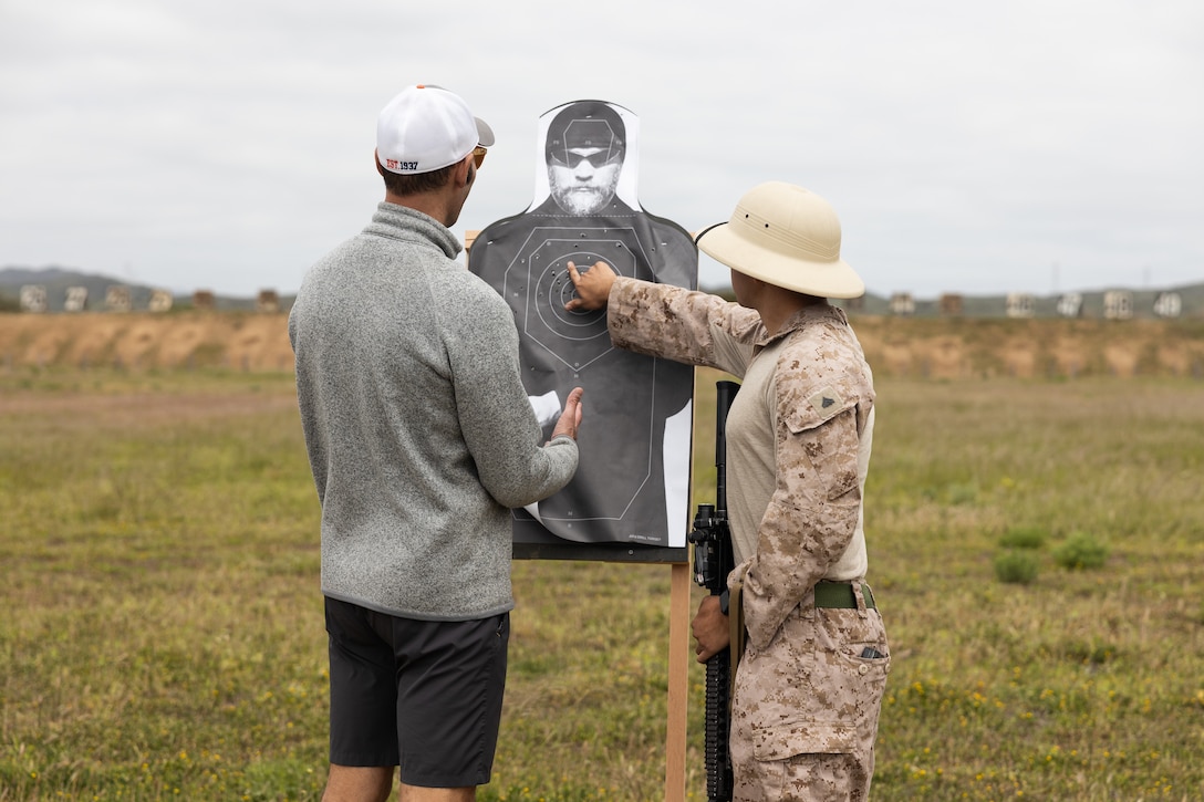 An educator with 12th Marine Corps District reviews his shots on target at Edson Range during an Educators’ Workshop event at Marine Corps Base Camp Pendleton in Oceanside, California, April 23, 2025. The Educators Workshop program provides selected educators and influential community members with an experiential opportunity to see how the Marine Corps transforms young men and women into Marines. The workshop also provides attendees with current information regarding Marine Corps training practices, military job skills, service opportunities, military lifestyle, and educational benefits available to Marines. (U.S. Marine Corps photo by Sgt. Andrew Bray)