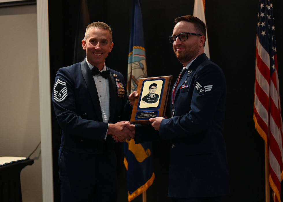U.S. Air Force Senior Airman David Hartman, 47th Healthcare Operations Squadron medic, receives the John L. Levitow award during the ALS Class 25-B graduation at the Powell Event Center, Goodfellow Air Force Base, Texas, May 22, 2025. The John L. Levitow Award is the highest accolade in professional military education and is presented to the highest-performing graduate in each iteration of ALS. (U.S. Air Force photo by Senior Airman Evelyn J. D’Errico)
