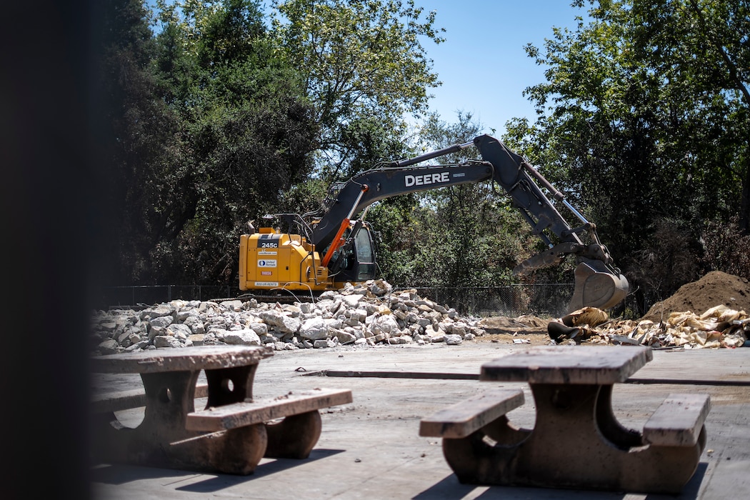 A contractor uses an excavator to remove concrete debris at the Native Plant Garden at Eaton Canyon Nature Center in Altadena, California, May 23, 2025. The effort is part of a broader wildfire recovery and debris removal mission managed by the U.S. Army Corps of Engineers.