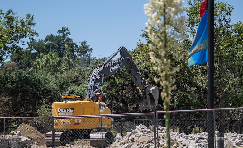 A contractor uses an excavator to remove concrete debris at the Native Plant Garden at Eaton Canyon Nature Center in Altadena, California, May 23, 2025. The effort is part of a broader wildfire recovery and debris removal mission managed by the U.S. Army Corps of Engineers.