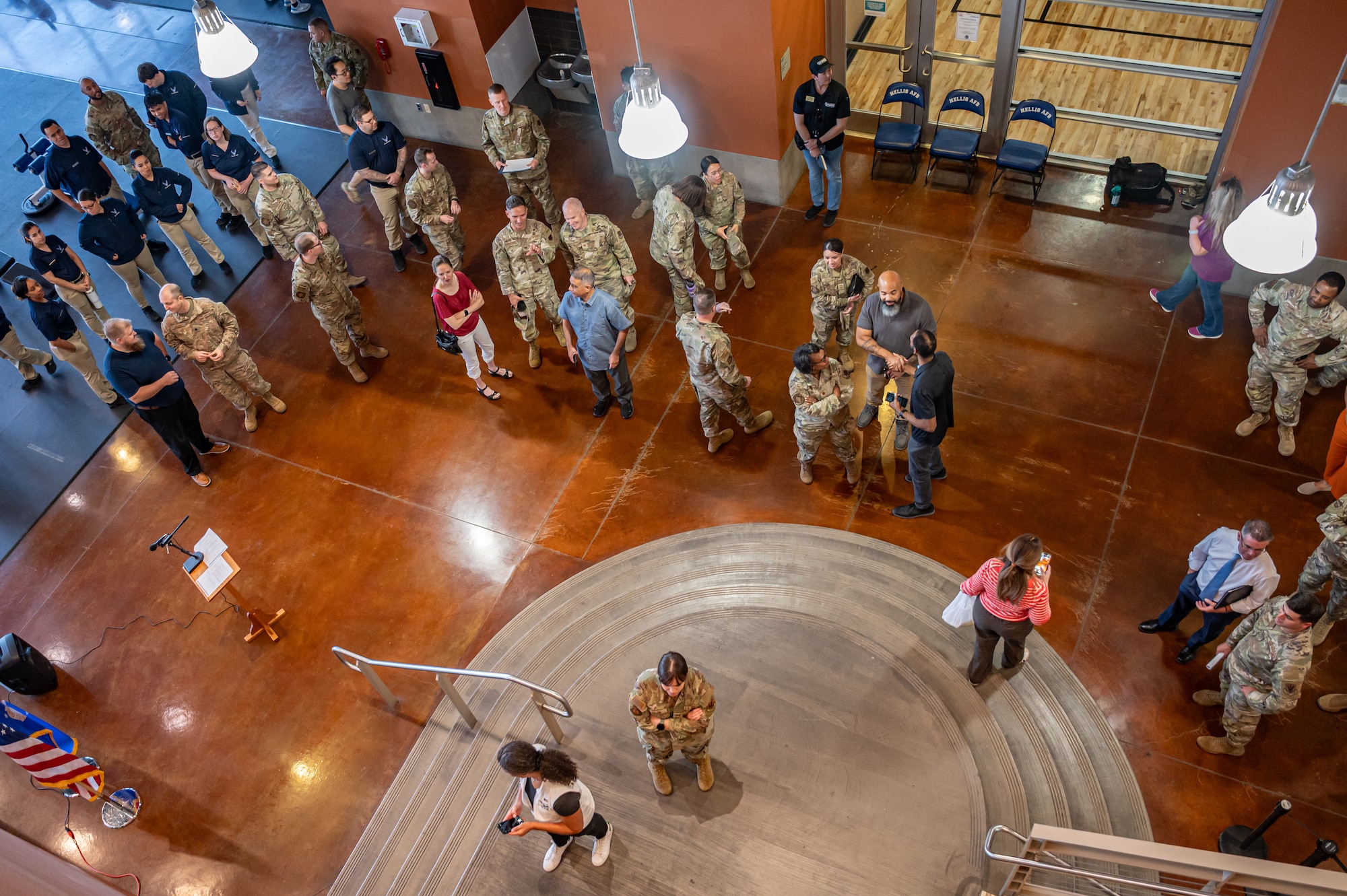 People gather by stairs.