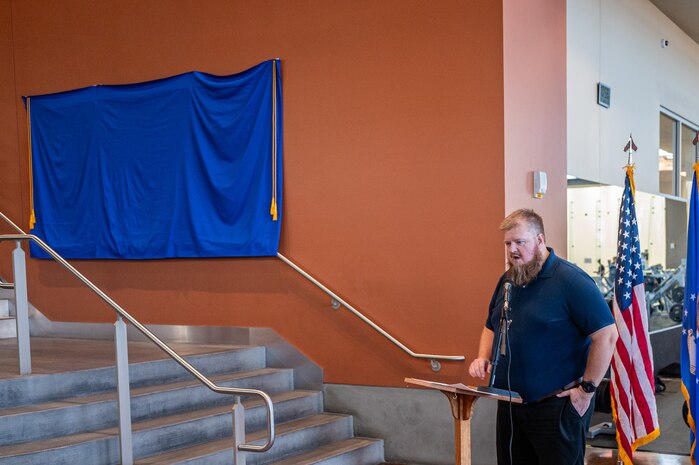 Man stands by stairs.
