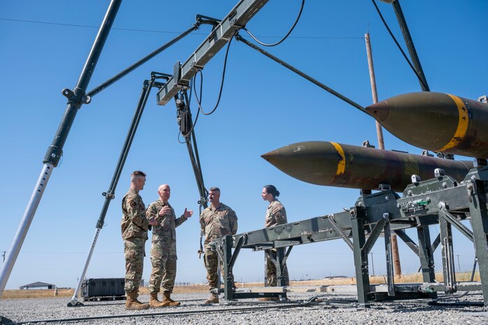 U.S. Air Force Chief of Staff Gen. David Allvin and Airmen assigned to the 9th Munitions Squadron (MUNS) discuss the operations of the Air Force Combat Ammunition Center at Beale Air Force Base, California, May 28, 2025.