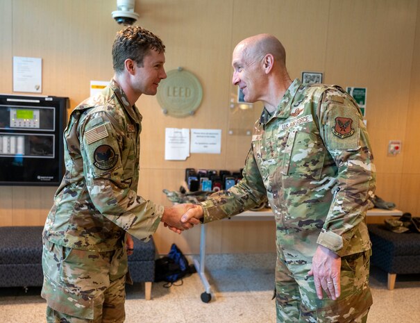 U.S. Air Force Chief of Staff Gen. David Allvin coins 1st Lt. Dylan Stanley, 9th Intelligence Squadron section commander, during a visit at Beale Air Force Base, California, May 28, 2025.