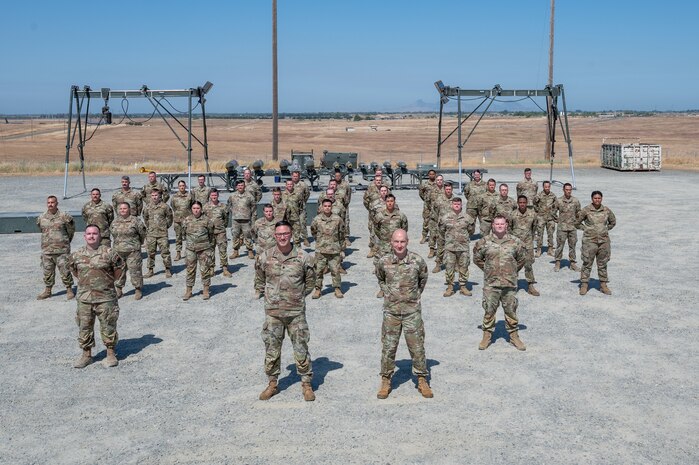 U.S. Air Force Chief of Staff Gen. David Allvin and Airmen assigned to the 9th Munitions Squadron (MUNS) pose for a photo at Beale Air Force Base, California, May 28, 2025.