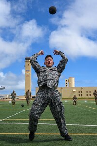 Photo of a Japanese Air Self-Defense Force service member completing a power throw during an advanced combat skills assessment