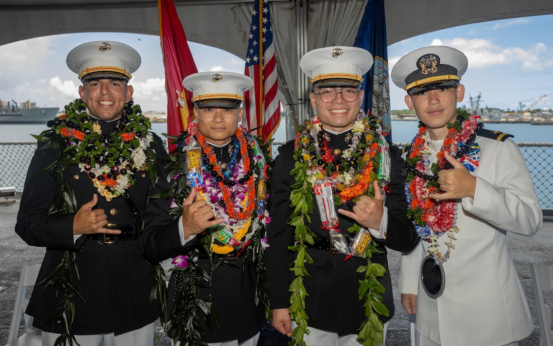 From left, University of Hawaii Navy ROTC 2nd Lt. Abraham Palacios, 2nd Lt. Dylan Kealohamauloa Yamaguchi, 2nd Lt. Anthony Venanico Tirao and Ensign Robert Reagan Nelson pose for a photo during a commissioning ceremony aboard the decommissioned battleship USS Missouri (BB 63) at Ford Island, Hawaii, May 22, 2025. The newly commissioned officers include 2nd Lt. Abraham Palacios, a native of El Paso, Texas; 2nd Lt. Anthony Venancio Tirao of Leesville, Louisiana; 2nd  Lt.Dylan Kealohamauloa Yamaguchi of Poipu, Hawaii; and Ensign Robert Reagan Nelson of Kapolei, Hawaii. The ceremony commissioned four University of Hawaii Naval Reserve Officers Training Corps students as officers, including the program’s first-ever group of Marine Corps officers. (U.S. Marine Corps photo by Lance Cpl. Jose Villasenor)