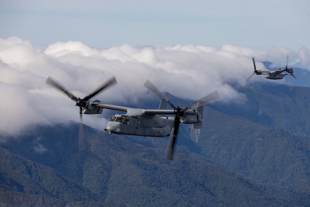 Two U.S. Marine Corps MV-22B Osprey aircraft assigned to Marine Medium Tiltrotor Squadron (VMM) 364, Marine Aircraft Group 39, 3rd Marine Aircraft Wing, fly in formation over Northern Luzon, Philippines, during KAMANDAG 9, May 27, 2025.