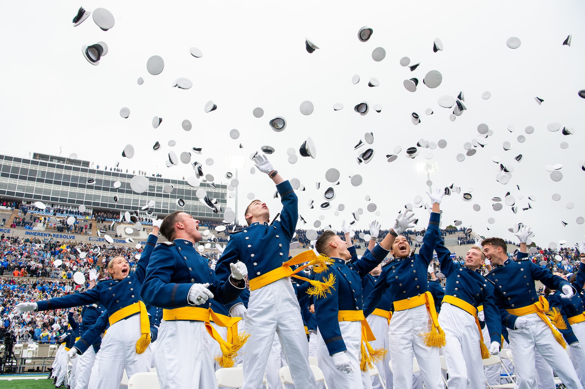 Hundreds of cadets toss their caps at graduation.