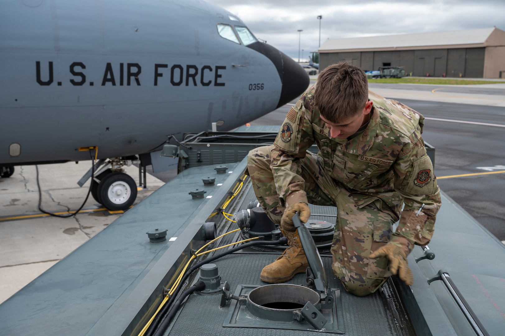 U.S. Air Force Airman 1st Class Holden Veeck, 92nd Logistics Readiness Squadron fuels management specialist, opens a manhole cover to check fuel levels during a Nuclear Staff Assistant Visit at Fairchild Air Force Base, Washington, May 19, 2025. The NSAV evaluated Fairchild and McConnell AFB’s ability to meet specific mission requirements in a time-constrained and contested environment. (U.S. Air Force photo by Airman 1st Class Samantha Thorn)