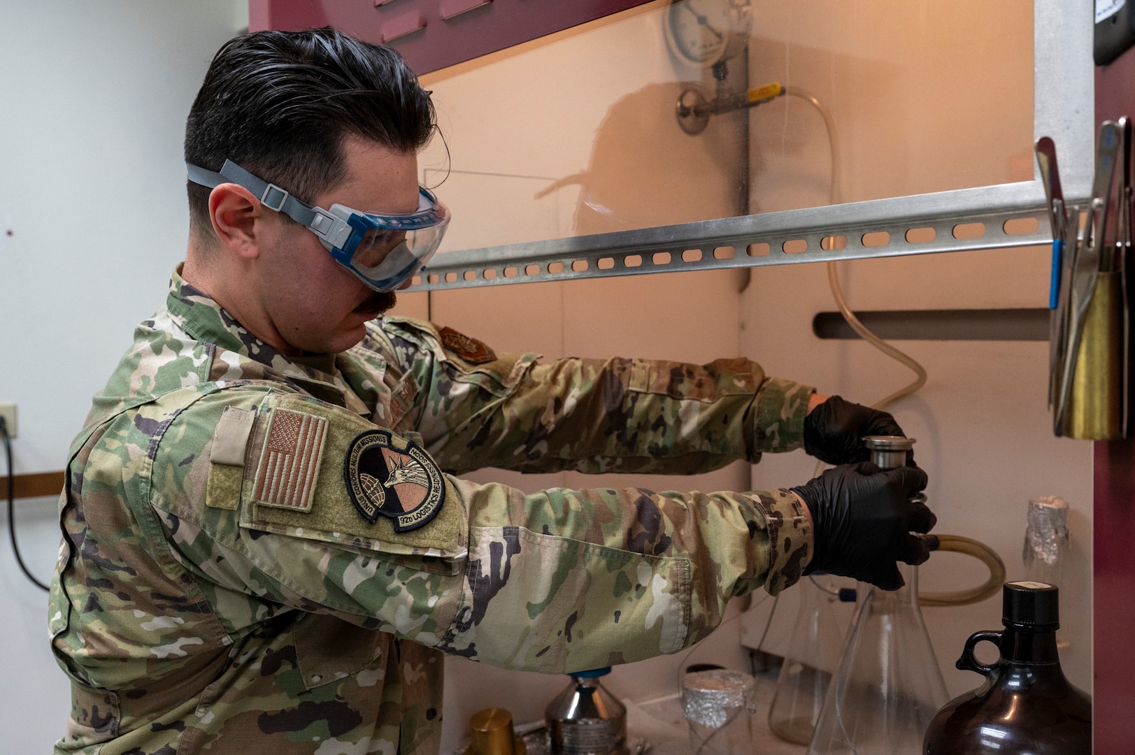 U.S. Air Force Senior Airman Rayland Libero, 92nd Logistics Readiness Squadron fuels lab technician, prepares to run a gravimetric determination test during a Nuclear Staff Assistant Visit at Fairchild Air Force Base, Washington, May 19, 2025. The NSAV is a total force readiness exercise which assesses the proficiency and abilities of Fairchild and McConnell AFB’s Airmen, continuing to maximize their capabilities that support the future fight. (U.S. Air Force photo by Airman 1st Class Samantha Thorn)