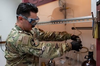 U.S. Air Force Senior Airman Rayland Libero, 92nd Logistics Readiness Squadron fuels lab technician, prepares to run a gravimetric determination test during a Nuclear Staff Assistant Visit at Fairchild Air Force Base, Washington, May 19, 2025. The NSAV is a total force readiness exercise which assesses the proficiency and abilities of Fairchild and McConnell AFB’s Airmen, continuing to maximize their capabilities that support the future fight. (U.S. Air Force photo by Airman 1st Class Samantha Thorn)