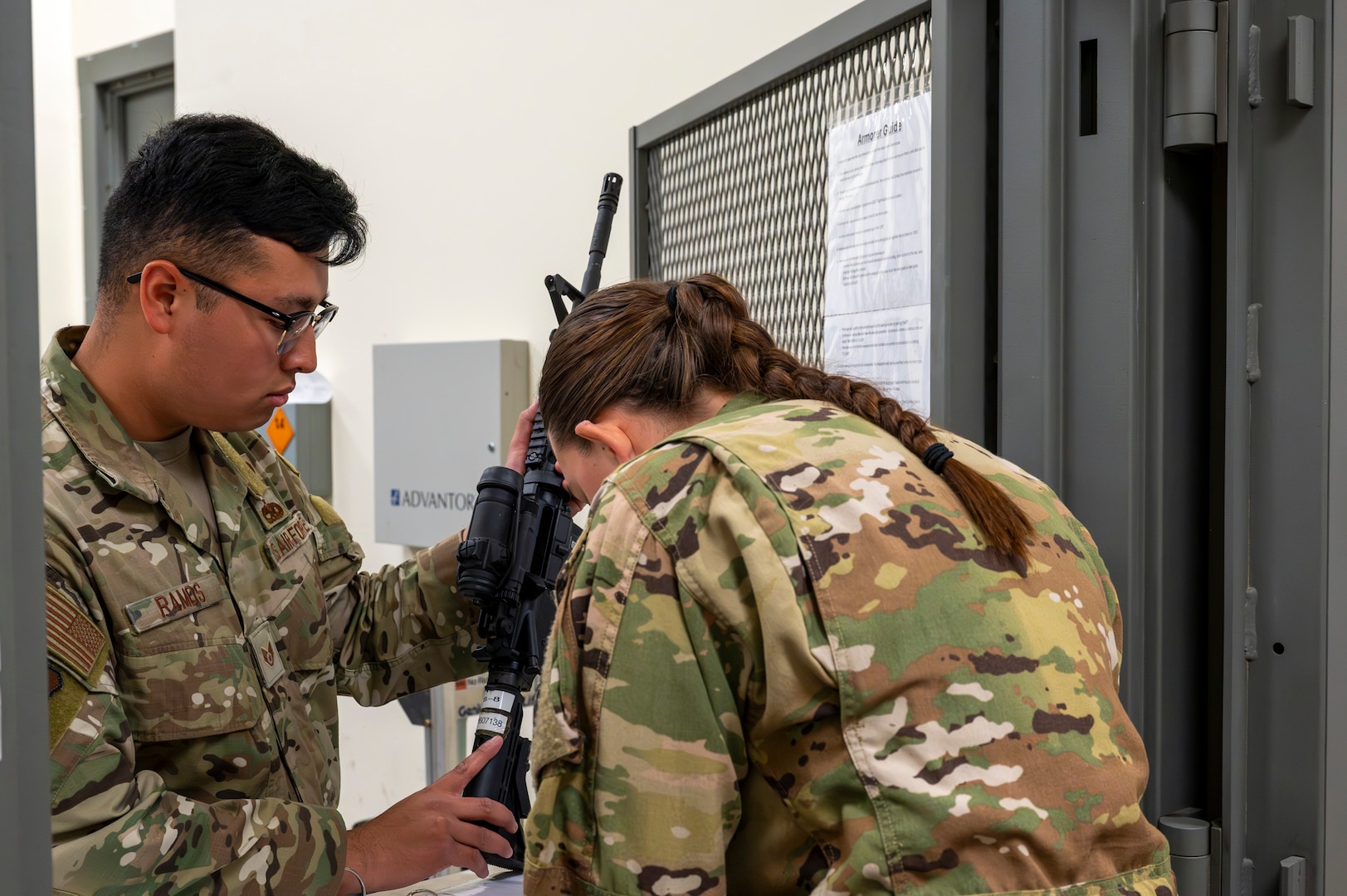 U.S. Air Force Staff Sgt. Bryan Ramos, 92nd Air Refueling Wing command post emergency action controller, issues weapons to an aircrew member during a Nuclear Staff Assistant Visit at Fairchild Air Force Base, Washington, May 19, 2025. The Nuclear Staff Assistance Visit is a total force readiness exercise which assesses the proficiency and abilities of both Fairchild and McConnell AFB’s Airmen, continuing to maximize their capabilities that support the future fight. (U.S. Air Force photo by Airman 1st Class Samantha Thorn)