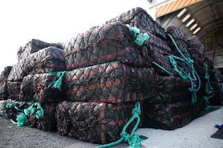 Drugs are stacked aboard USCGC Thetis during a drug offload in Port Everglades.