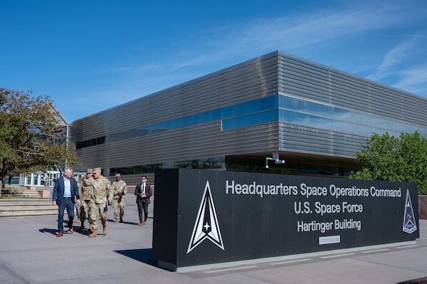 Secretary of the Air Force Troy Meink (left) walks with U.S. Space Force Lt. Gen. David N. Miller, Jr. (pointing ahead), Commander of Space Operations Command, at Peterson Space Force Base, Colorado, May 28, 2025. Space Operations Command Guardians and Airmen demonstrated their combat readiness and warrior ethos, providing Meink with a deep dive into multiple critical mission areas, to include Space Domain Awareness; Electromagnetic Warfare; Missile Warning; Intelligence, Surveillance, Reconnaissance and Targeting; Orbital Warfare and Positioning, Navigation and Timing; as well as the critical mission support provided by the U.S. Air Force.  (U.S. Space Force photo by Dave Grim)