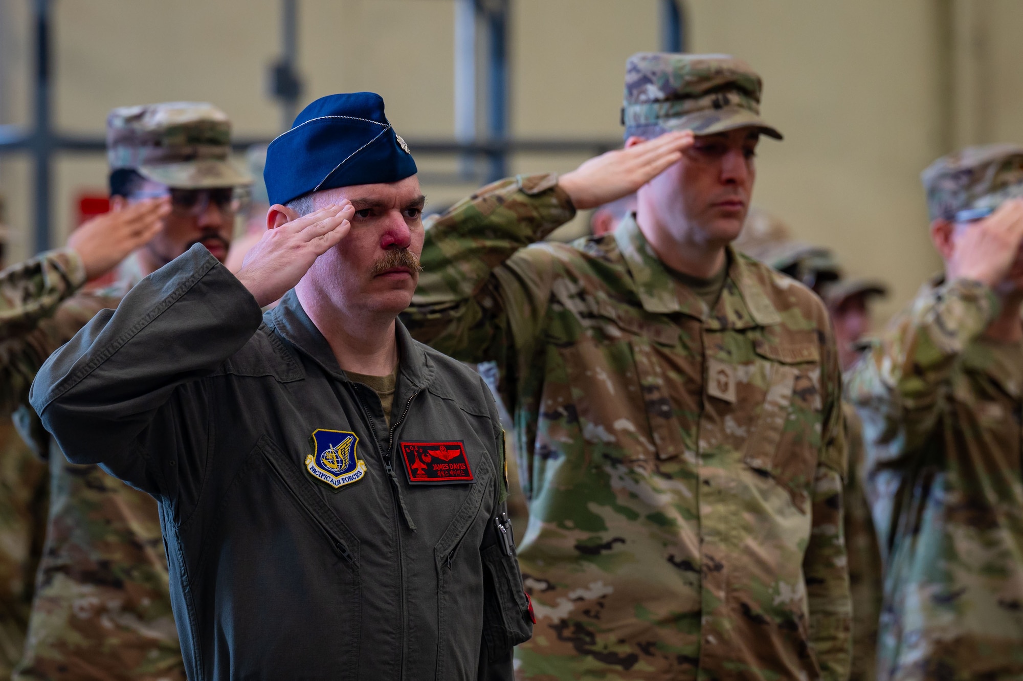 U.S. Air Force Col. James Davis, 8th Operations Support Squadron commander, renders a salute during the national anthem at Kunsan Air Base, Republic of Korea, May 30, 2025.