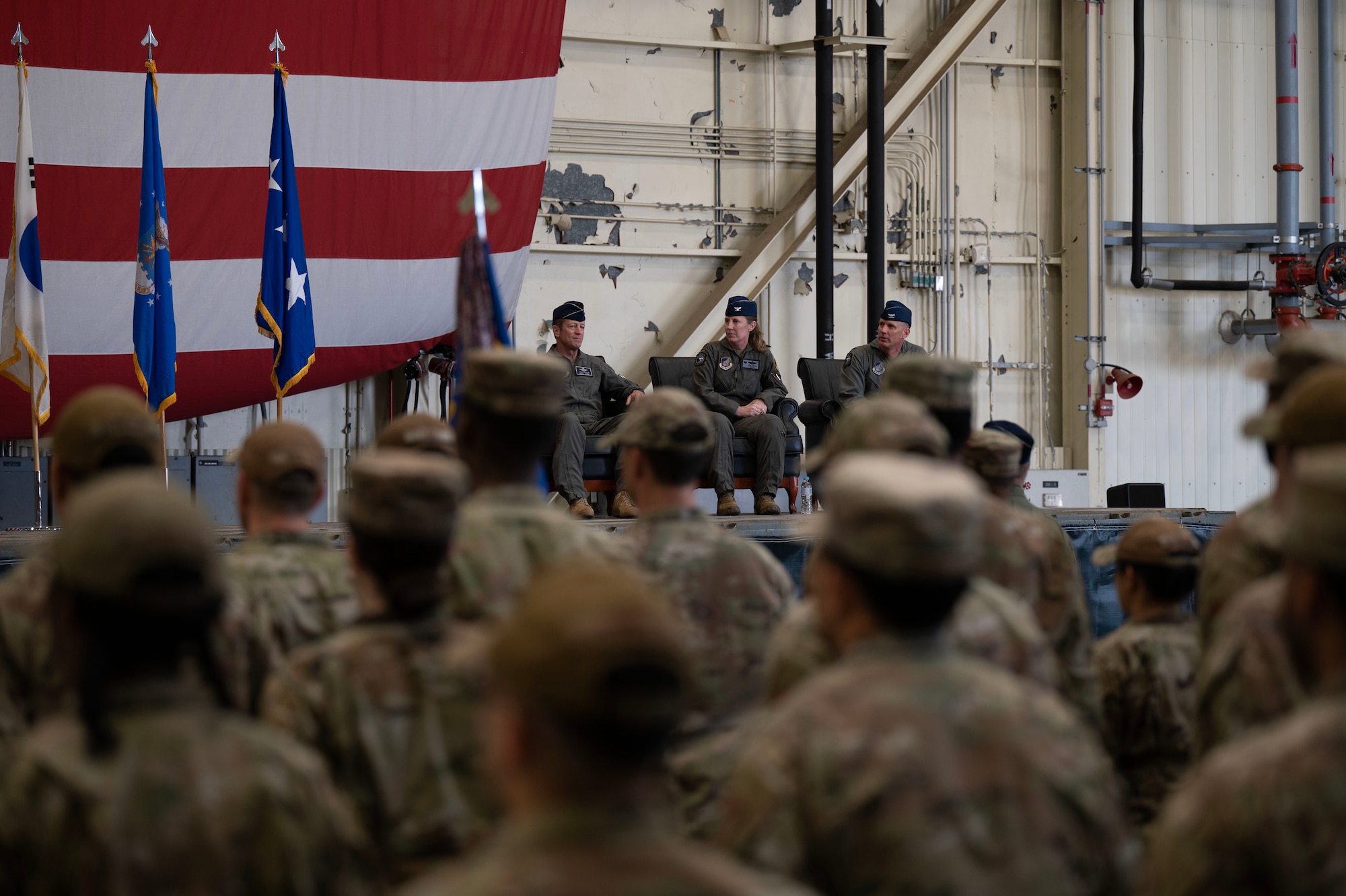 From left to right: U.S. Air Forces Lt. Gen. David Iverson, 7th Air Force commander, Col. Kathryn Gaetke, current 8th Fighter Wing commander, and Col. Peter Kasarskis, former 8th Fighter Wing designate a new commander of the Wolfpack during a change of command ceremony at Kunsan Air Base, Republic of Korea, May 30, 2025.