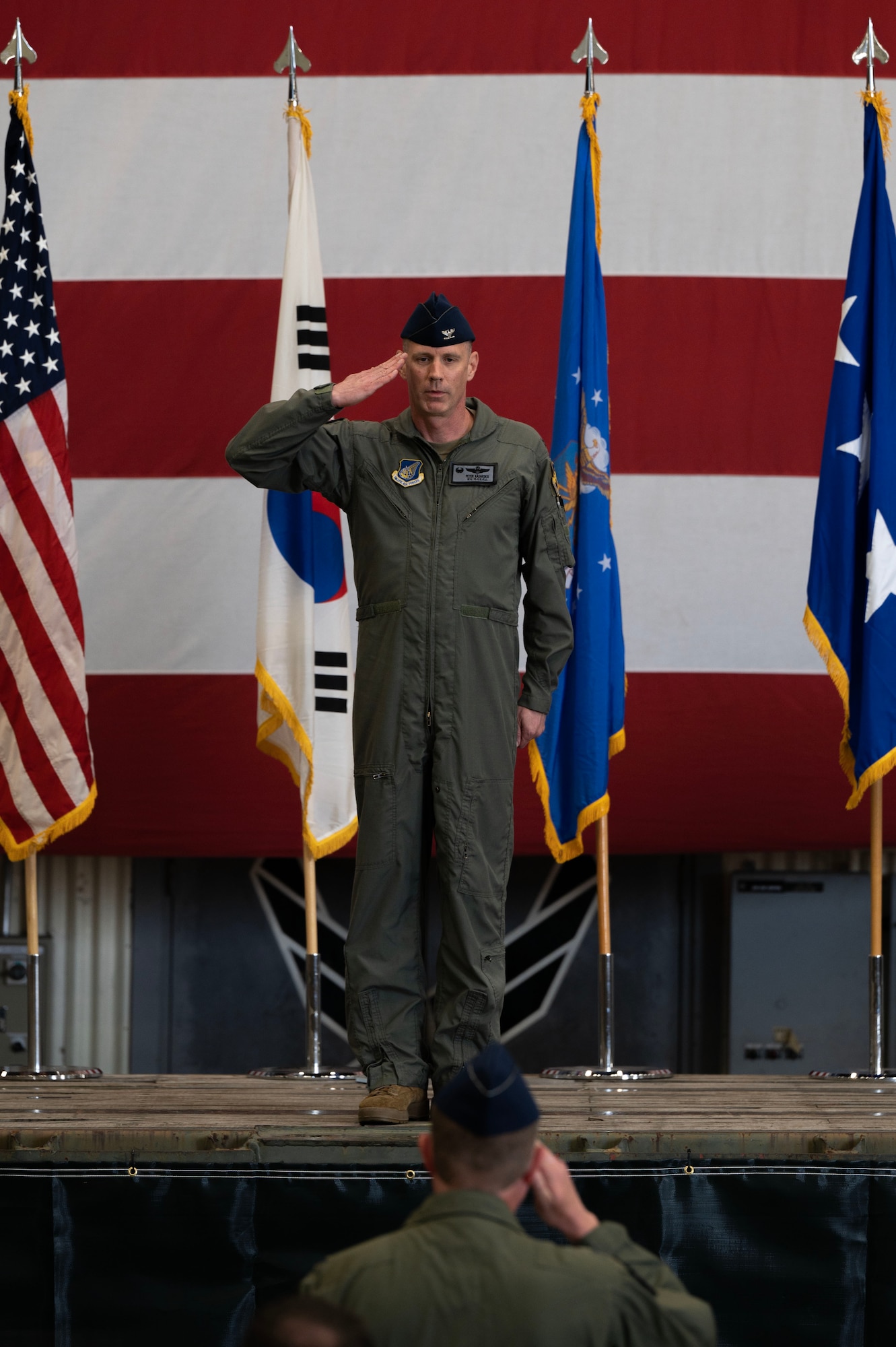 U.S. Air Force Col. Peter Kasarskis, outgoing 8th Fighter Wing commander, renders his final salute to U.S. Air Force Col. Christopher Mulder, 8th Fighter Wing deputy commander, and members of the 8th Fighter Wing during a change of command ceremony at Kunsan Air Base, May 30, 2025.