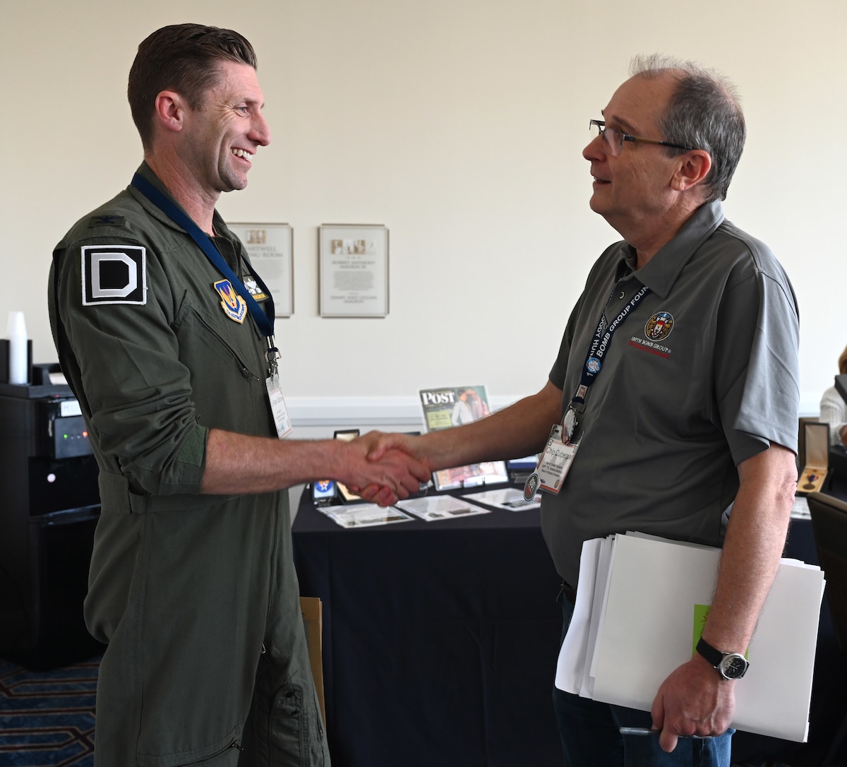 U.S. Air Force Col. Ryan Garlow, left, 100th Air Refueling Wing commander, is greeted by Chip Culpepper, 100th Bomb Group Foundation president, at the 100th BG reunion in New Orleans, La., May 16, 2025. Garlow is the step-grandson of Tech. Sgt. James P. Scott, 100th BG and 351st Bomb Squadron radio operator/gunner, and Culpepper is the son of Tech. Sgt. Conley Culpepper, 100th BG and 349th BS top turret gunner and engineer. (U.S. Air Force photo by Karen Abeyasekere)