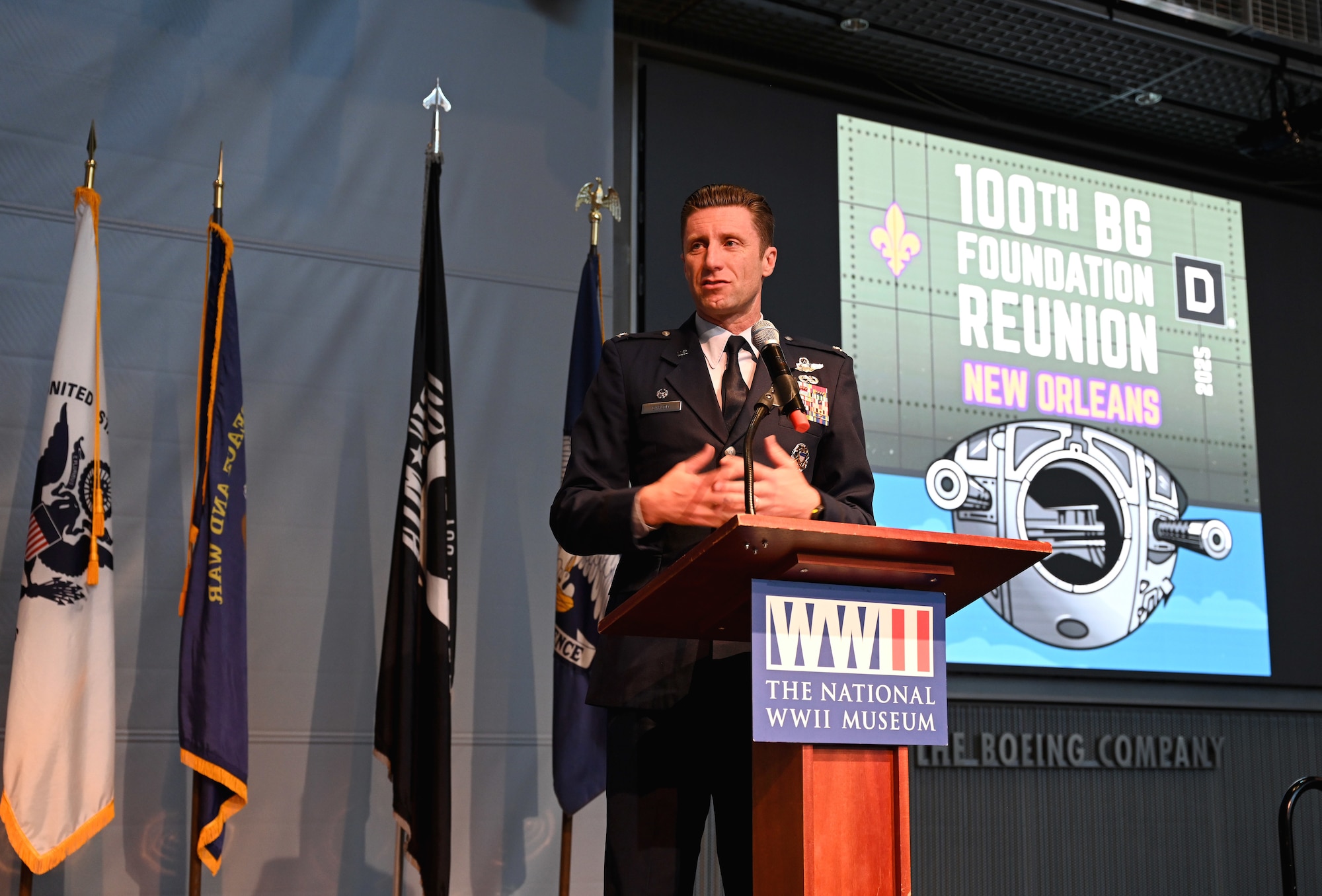U.S. Air Force Col. Ryan Garlow, 100th Air Refueling Wing commander, RAF Mildenhall, speaks to the audience at the 100th Bomb Group reunion about how proud he is of the strong bond and legacy between the 100th BG and 100th ARW, at the National World War II Museum, New Orleans, La., May 17, 2025. Garlow also spoke about the mission of today’s 100th ARW and his personal connection with the 100th BG. (U.S. Air Force photo by Karen Abeyasekere)