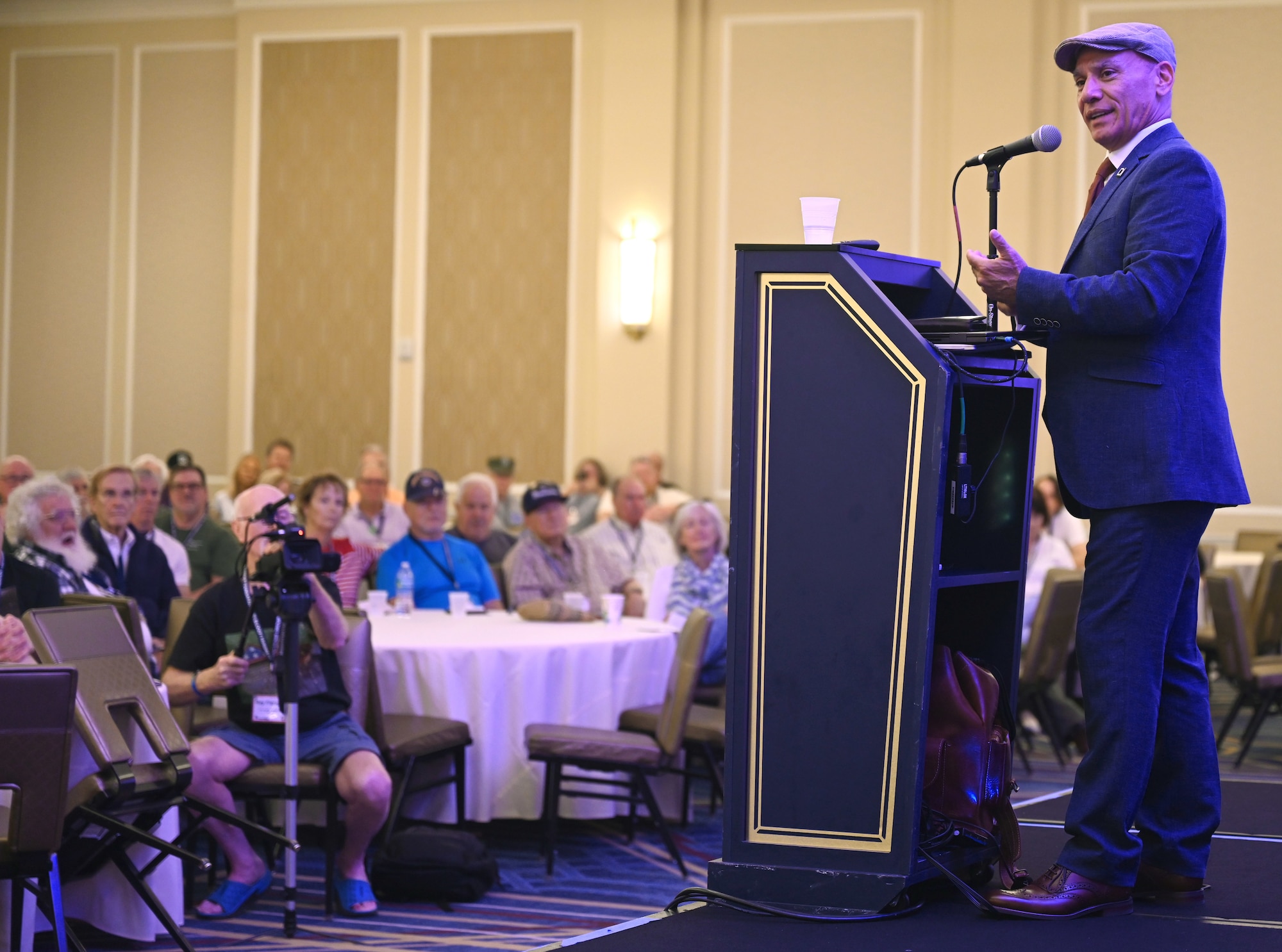 Rob Paley, 100th Air Refueling Wing historian and retired U.S. Army major, speaks to 100th Bomb Group veterans, families and friends at the 100th BG reunion at New Orleans, La., May 17, 2025. Paley shared how he became the historian at RAF Mildenhall, and how his love of the 100th BG first began when he was 12 years old. (U.S. Air Force photo by Karen Abeyasekere)