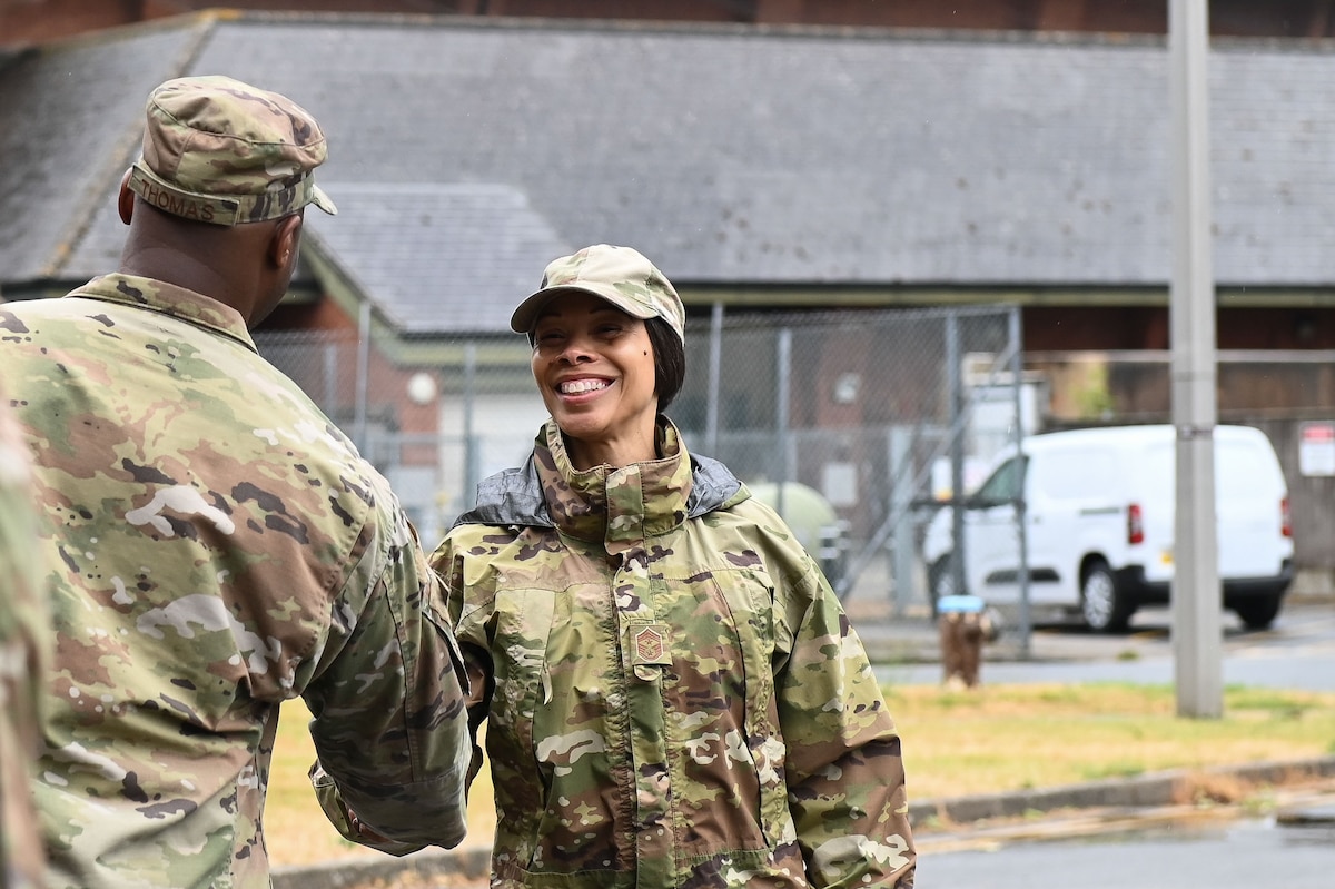 U.S. Air Force Chief Master Sgt. Tiffany Griego, 100th Air Refueling Wing command chief, arrives at the ribbon cutting ceremony for the newly renovated dormitory on RAF Mildenhall, England, May 28, 2025.