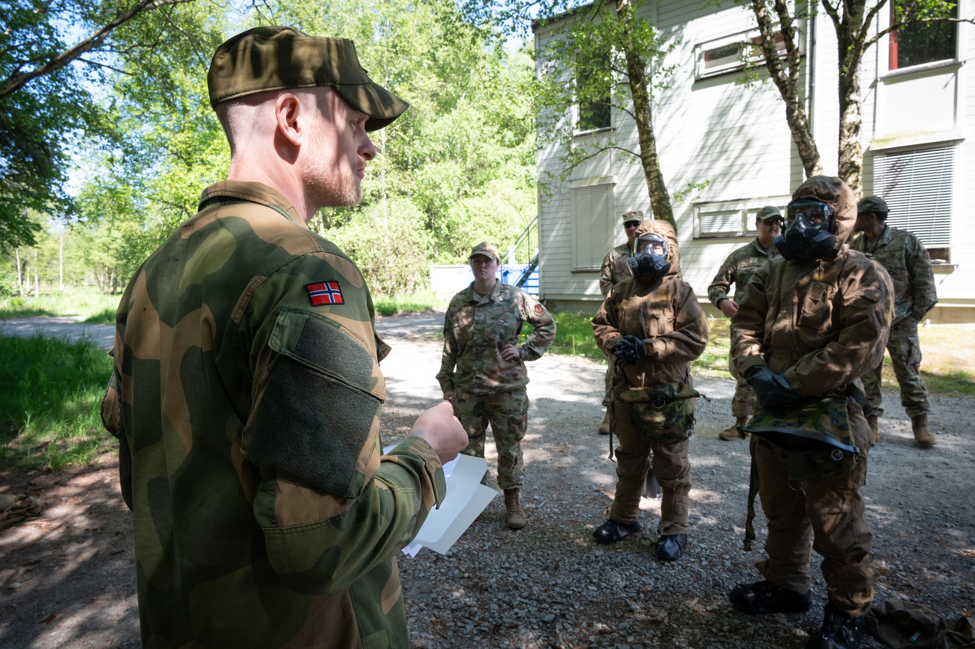 Royal Norwegian Navy Chief Petty Officer Dag Tore, force protection team leader, instructs U.S. Airmen