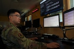 U.S. Air Force Capt. Isaac Tian, a cyber operations officer with the 262nd Cyber Operations Squadron, Washington Air National Guard, analyzes data for evidence of adversary indicators of compromise on Joint Base Lewis-McChord, Wash., April 6, 2025. Tian is among the first Air National Guard members to be selected under a newly established direct commission program for cyber professionals.