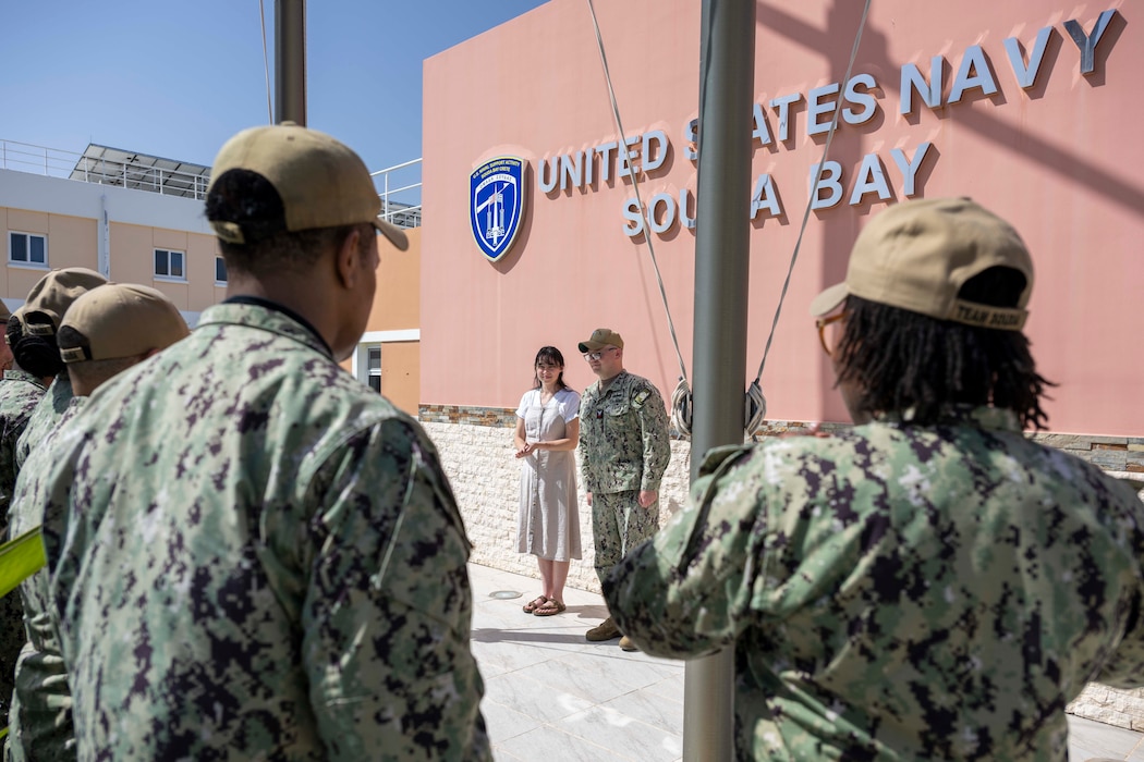 Religious Program Specialist 1st Class Michael Dube, assigned to Naval Support Activity Souda Bay, is frocked by his wife, Emily Dube, after being advanced through the Meritorious Advancement Program onboard NSA Souda Bay, Greece, on May 22, 2025.