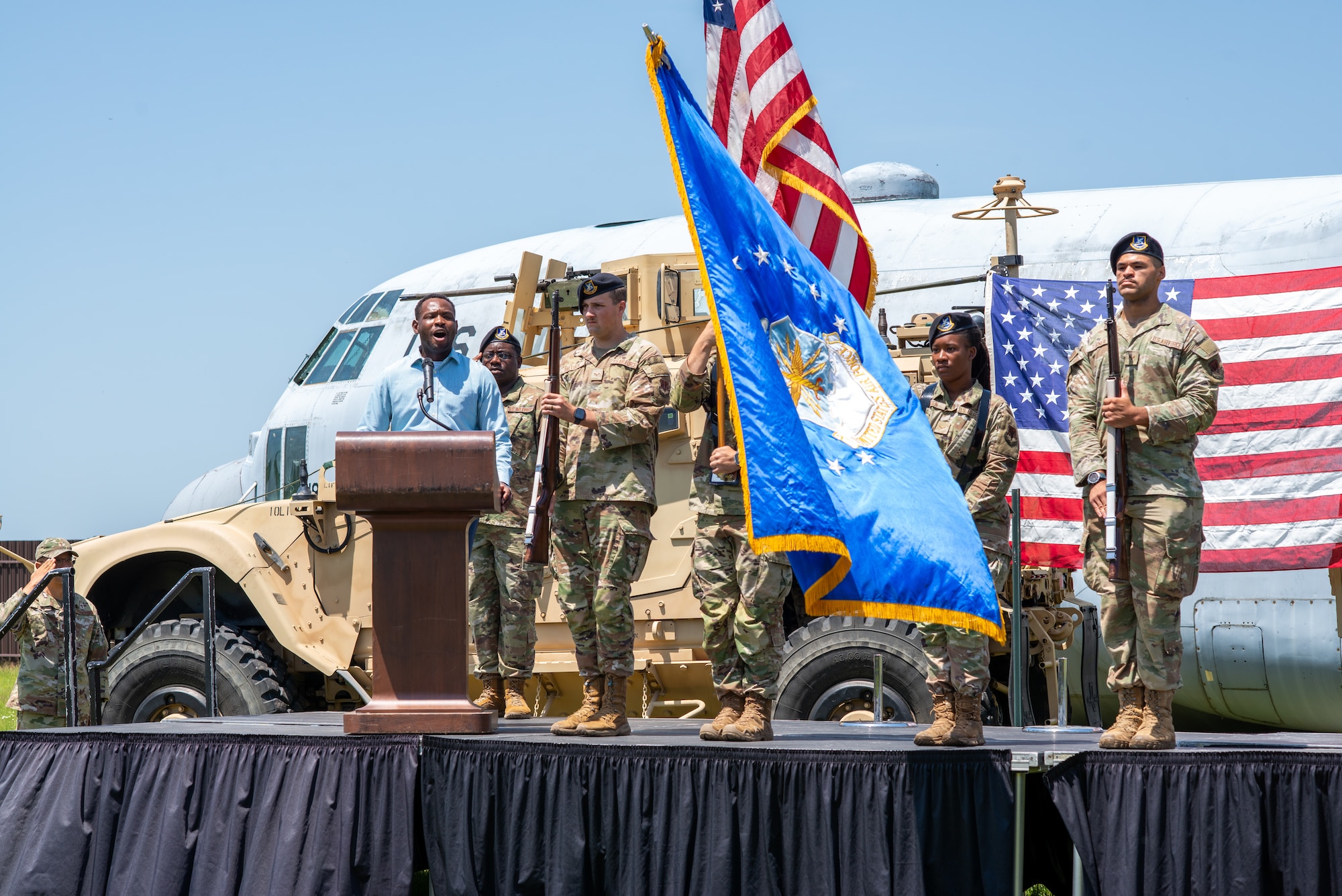 Group of people standing on a stage.