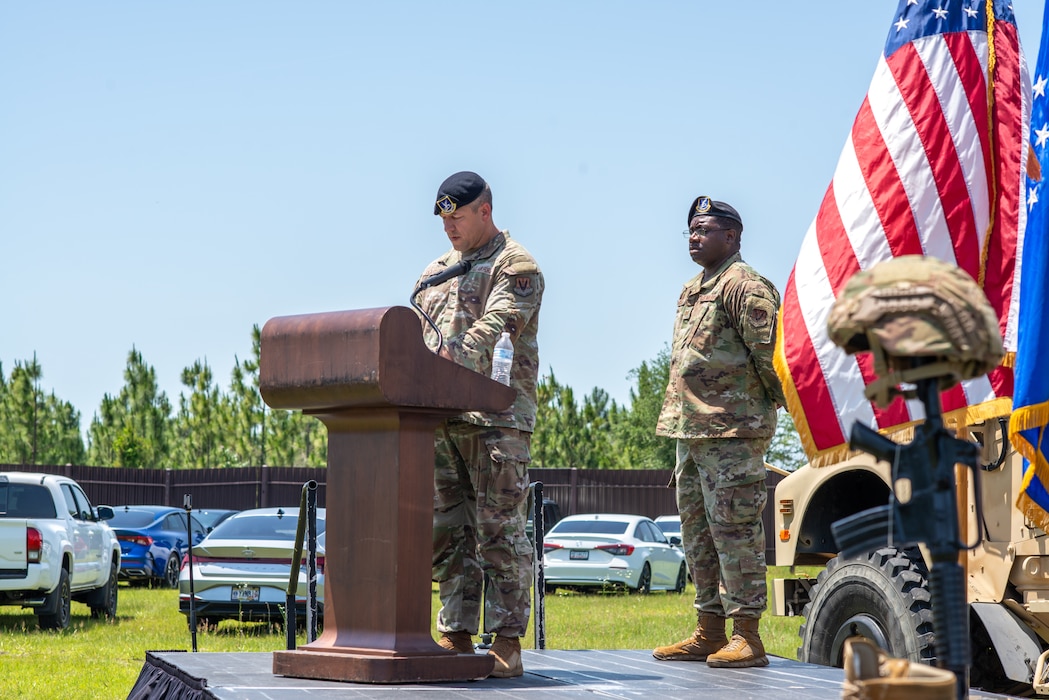 Two people standing on a stage.