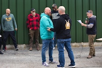 A team member is recognized by the Army Field Support Battalion-Benelux commander, Lt. Col. George Horne, at the AFSBn-Benelux hosted organizational day at the Zutendaal Army Prepositioned Stocks-2 worksite in Belgium May 22. (Photo by George Bellon)