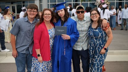 Sgt. 1st Class Alberto Alvarez and his family attending a family member's graduation.