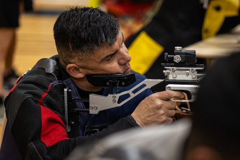 U.S. Army Sgt. 1st Class Alberto Alvarez prepares to fire an air rifle during shooting practice at the 2025 Army Trials, Fort Bliss, Texas, April 3, 2025.
