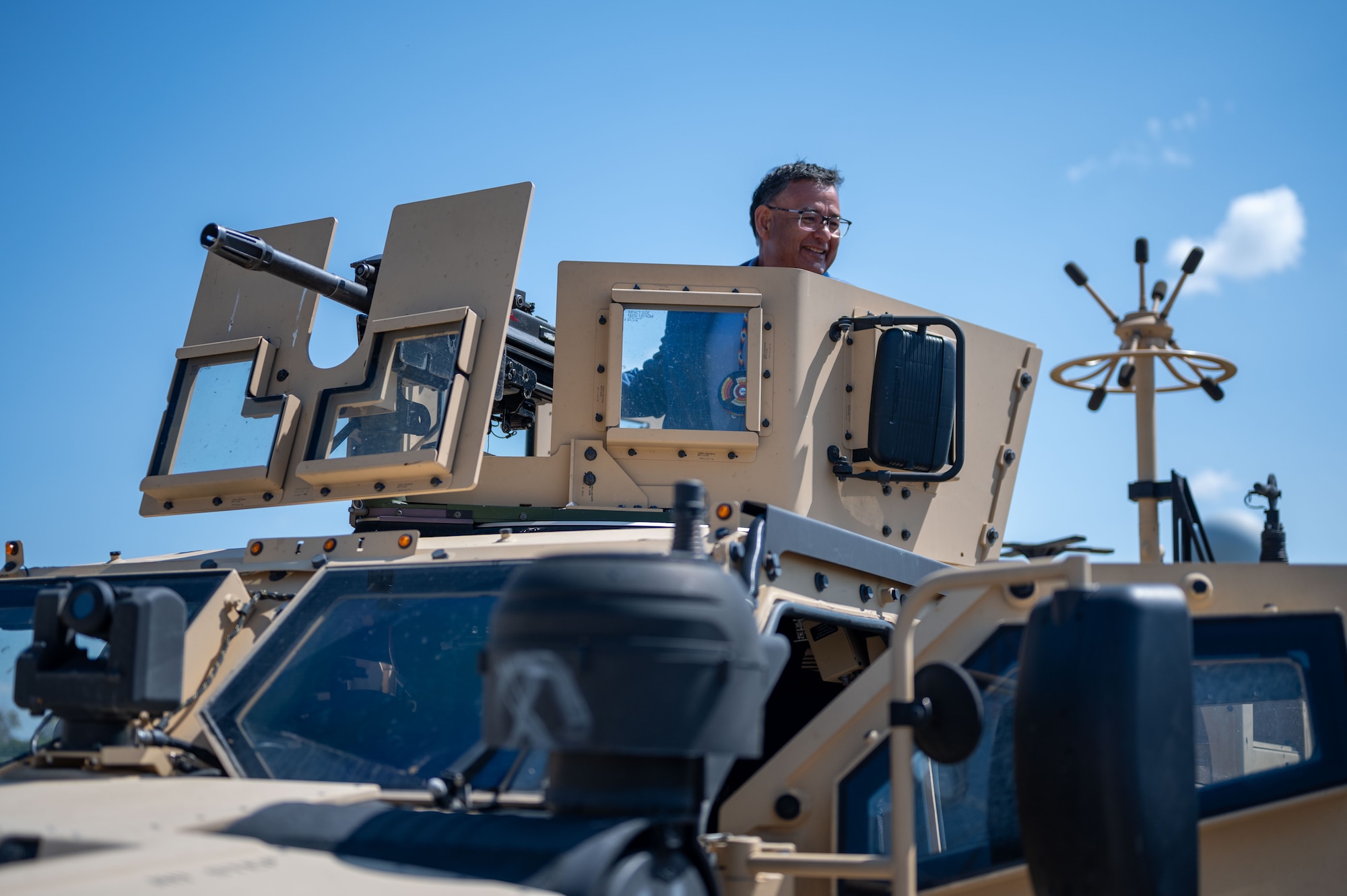 Mark Fox, chairman of the Mandan, Hidatsa and Arikara Nation, explores the interior of a Joint Light Tactical Vehicle during a visit to Missile Alert Facility H-01 at Minot Air Force Base, North Dakota May 27, 2025. The tour fostered collaboration and strengthened ties between the MHA Nation and the Minot AFB community. (U.S. Air Force photo by Airman 1st Class Luis Gomez)
