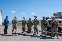 Mark Fox, chairman of the Mandan, Hidatsa and Arikara Nation, (left) receives a mission brief during a tour of Missile Alert Facility H-01 at Minot Air Force Base, North Dakota May 27, 2025. The visit provided an opportunity for Fox to learn about the 91st Missile Wing’s mission and engage with personnel serving at the remote site. (U.S. Air Force photo by Airman 1st Class Luis Gomez)