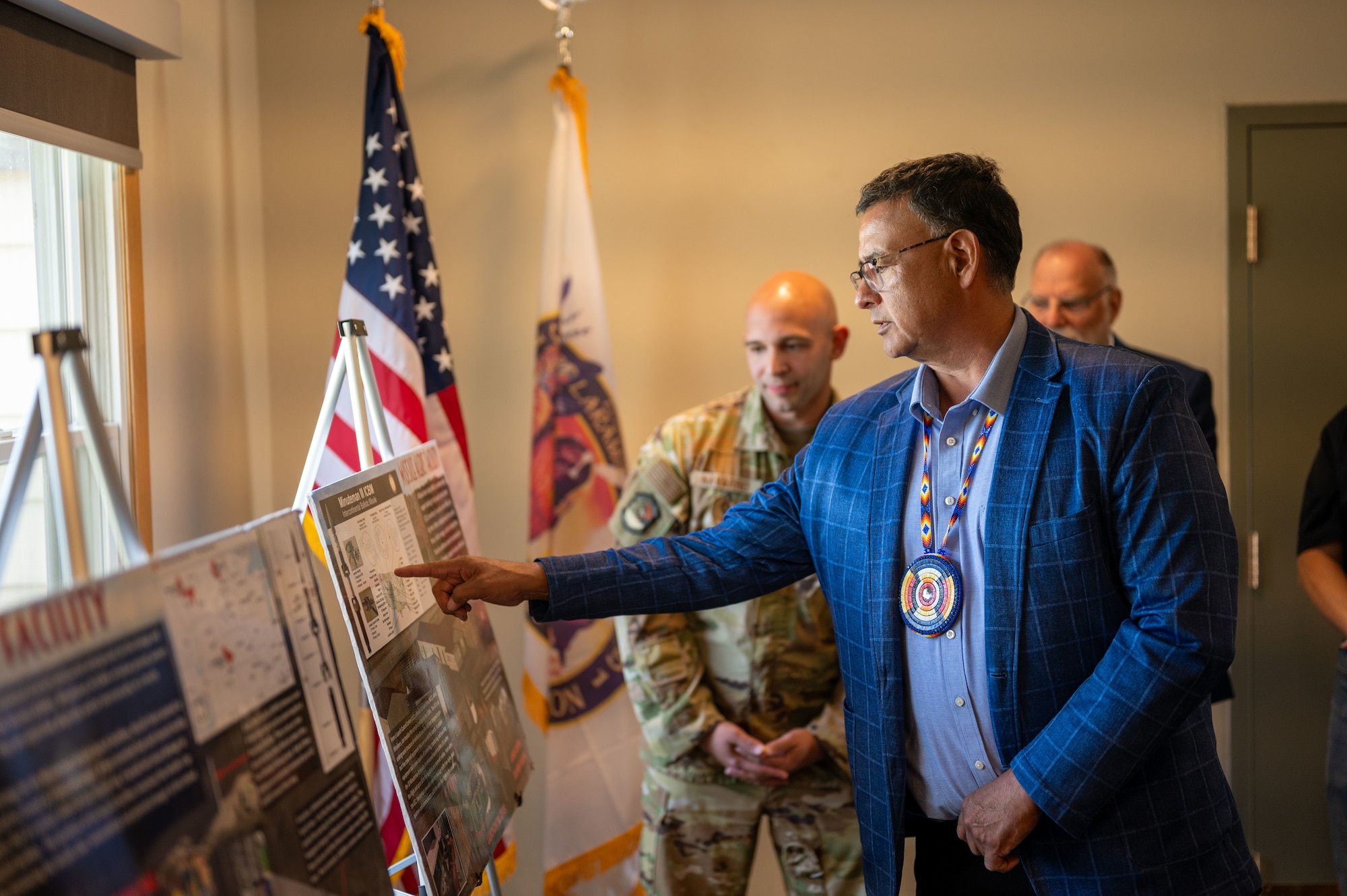 Mark Fox, chairman of the Mandan, Hidatsa and Arikara Nation, receives a mission brief during a visit to Missile Alert Facility H-01 at Minot Air Force Base, North Dakota, May 27, 2025. The tour fostered collaboration and strengthened ties between the MHA Nation and the Minot AFB community. (U.S. Air Force photo by Airman 1st Class Luis Gomez)