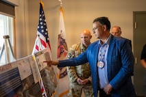 Mark Fox, chairman of the Mandan, Hidatsa and Arikara Nation, receives a mission brief during a visit to Missile Alert Facility H-01 at Minot Air Force Base, North Dakota, May 27, 2025. The tour fostered collaboration and strengthened ties between the MHA Nation and the Minot AFB community. (U.S. Air Force photo by Airman 1st Class Luis Gomez)