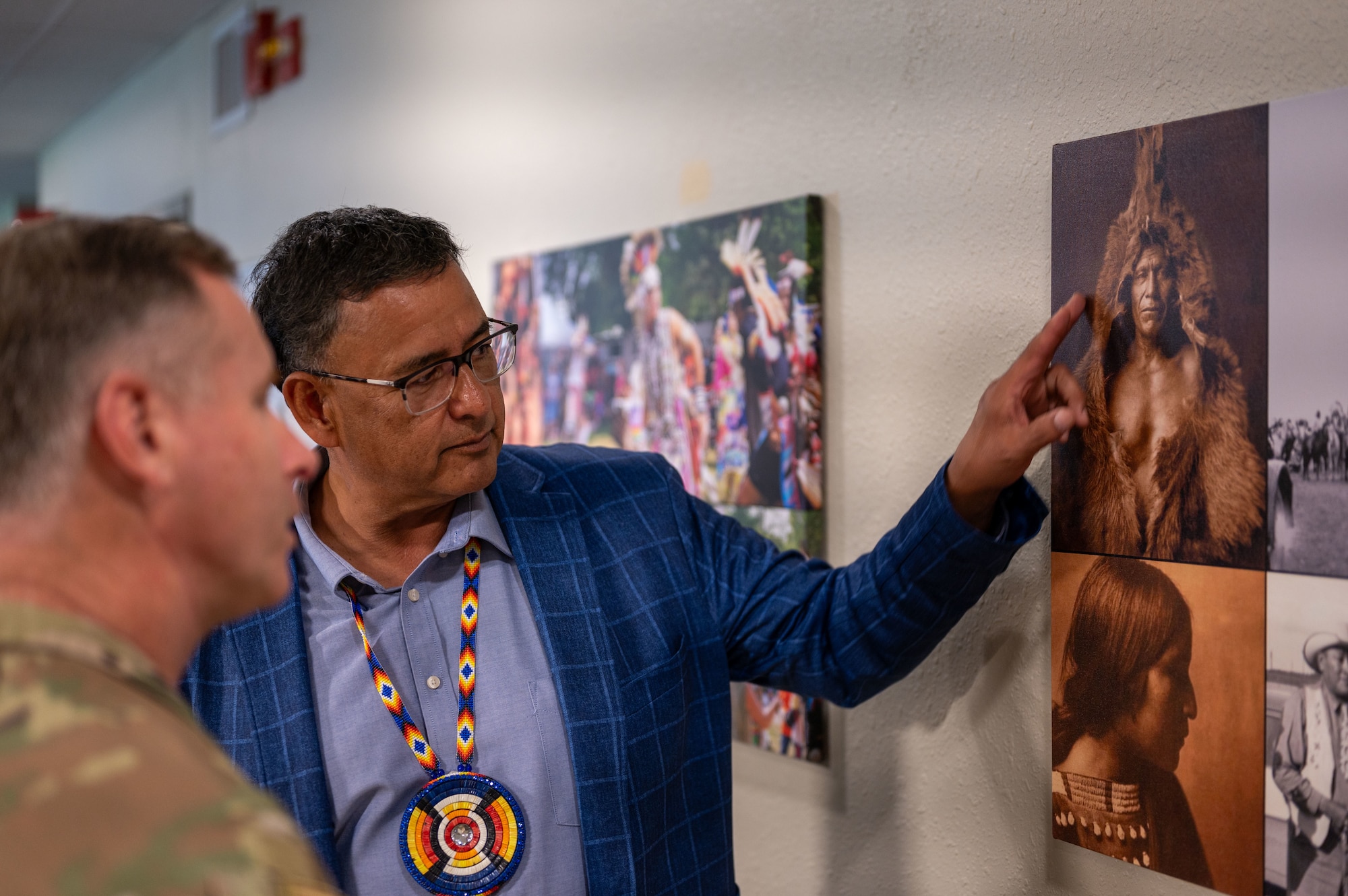 Mark Fox, chairman of the Mandan, Hidatsa and Arikara Nation, (right) discusses Native American heritage with Col. James Schlabach, 91st Missile Wing commander (left), during a tour of Minot Air Force Base, North Dakota, May 27, 2025. Fox and tribal representatives visited Missile Alert Facility H-01 to strengthen relationships and exchange cultural understanding with Air Force personnel. (U.S. Air Force photo by Airman 1st Class Luis Gomez)