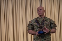 U.S. Air Force Lt. Col. Ronald Feeser, 5th Bomb Wing chaplain, thanks Team Minot’s chaplains after accepting the Air Force Global Strike Command large team chaplain corps team of the year award at Minot Air Force Base, North Dakota, May 28, 2025. Chaplains provide all authorized individuals access to faith opportunities, confidentiality and personal guidance. (U.S. Air Force photo by Senior Airman Alyssa Bankston)
