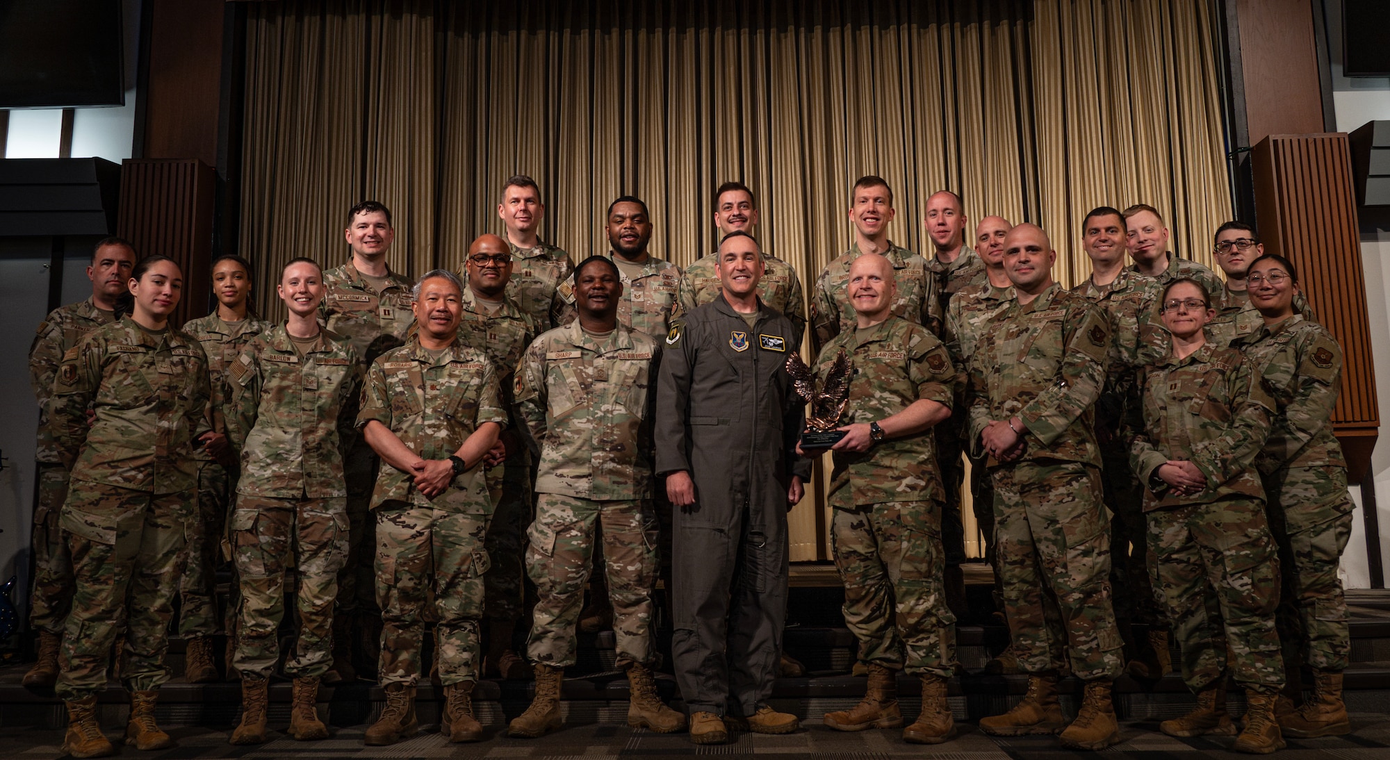 5th Bomb Wing command poses with Team Minot’s chaplains, winners of the Air Force Global Strike Command large team chaplain corps team of the year award at Minot Air Force Base, North Dakota, May 28, 2025. The chaplain corps lines of effort include fortifying warfighter readiness, reimaging chaplain culture and rebuilding chaplain readiness, on which the team award selections are based. (U.S. Air Force photo by Senior Airman Alyssa Bankston)