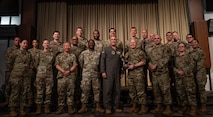 5th Bomb Wing command poses with Team Minot’s chaplains, winners of the Air Force Global Strike Command large team chaplain corps team of the year award at Minot Air Force Base, North Dakota, May 28, 2025. The chaplain corps lines of effort include fortifying warfighter readiness, reimaging chaplain culture and rebuilding chaplain readiness, on which the team award selections are based. (U.S. Air Force photo by Senior Airman Alyssa Bankston)