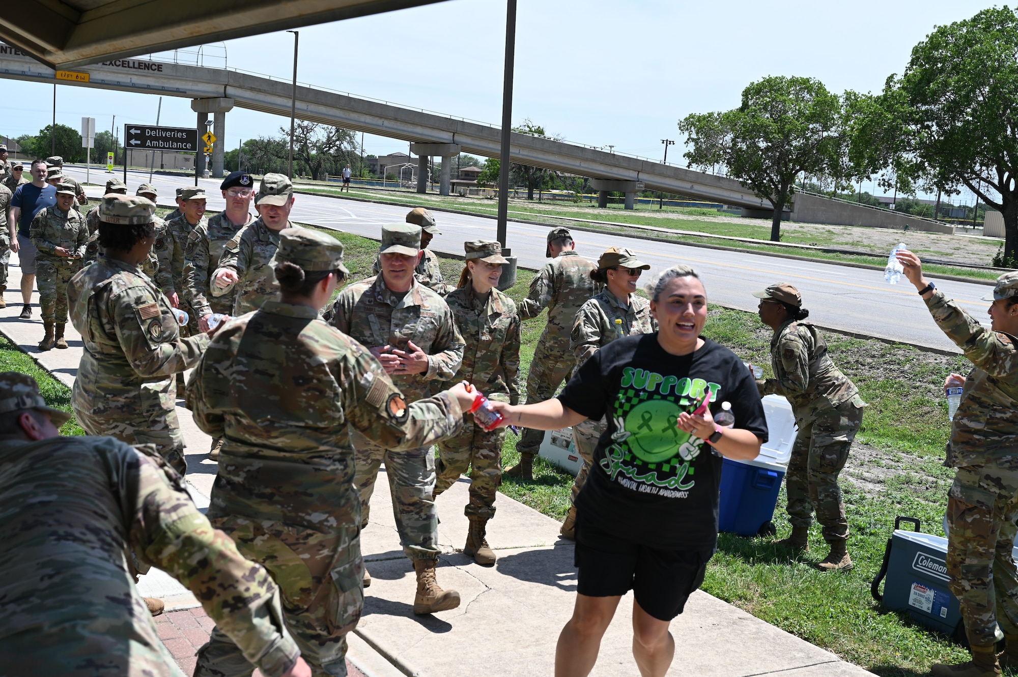Frances Martinez, 960th CW director of psychological health, and other servicemembers arrives at the first rest station during the mental health awareness walk on JBSA-Lackland, Texas on May 3, 2025. (US Air Force photo by Alex Dieguez)
