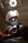 Senior Airman Jose Vazquez-Vera, 5th Operational Medical Readiness Squadron (OMRS) oral preventive assistant technician, performs a dental cleaning during a routine dental appointment at Minot Air Force Base, North Dakota, May 28, 2025. To keep Airmen mission-ready, the 5OMRS dental flight works to provide service members with the best possible care. (U.S. Air Force photo by Senior Airman Alyssa Bankston)