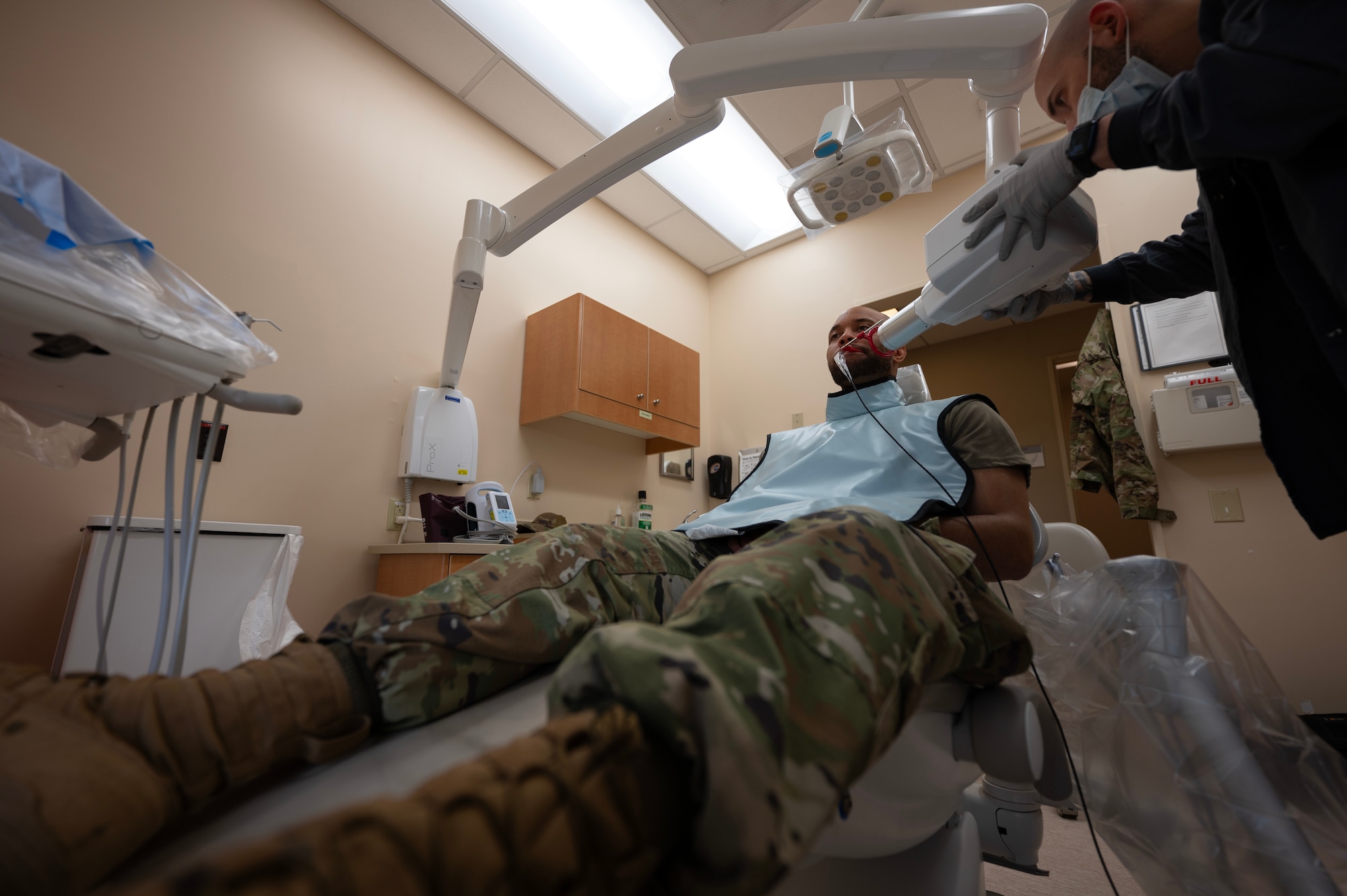 Airman 1st Class Anthony Ramey, 5th Bomb Wing public affairs specialist, gets a routine dental checkup at Minot Air Force Base, North Dakota, May 28, 2025. The 5th Operational Medical Readiness Squadron dental flight provides services, such as annual exams, X-rays and specialist referrals. (U.S. Air Force photo by Senior Airman Alyssa Bankston)
