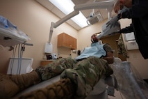 Airman 1st Class Anthony Ramey, 5th Bomb Wing public affairs specialist, gets a routine dental checkup at Minot Air Force Base, North Dakota, May 28, 2025. The 5th Operational Medical Readiness Squadron dental flight provides services, such as annual exams, X-rays and specialist referrals. (U.S. Air Force photo by Senior Airman Alyssa Bankston)