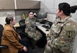 Army Reserve Staff Sgt. Aisha Harper, center, briefs Leigh Anne Alexander, left, director of U.S. Army Medical Logistics Command’s Integrated Logistics Support Center, on her work completed at AMLC as part of U.S. Army Communications-Electronic Command’s Detachment 7 program. DET 7, as it’s commonly known, supports CECOM units with reserve Soldiers who can complete their annual training requirements in functional commands, such as AMLC. Also pictured is Capt. Vanessa Vasquez, another DET 7 Soldier.