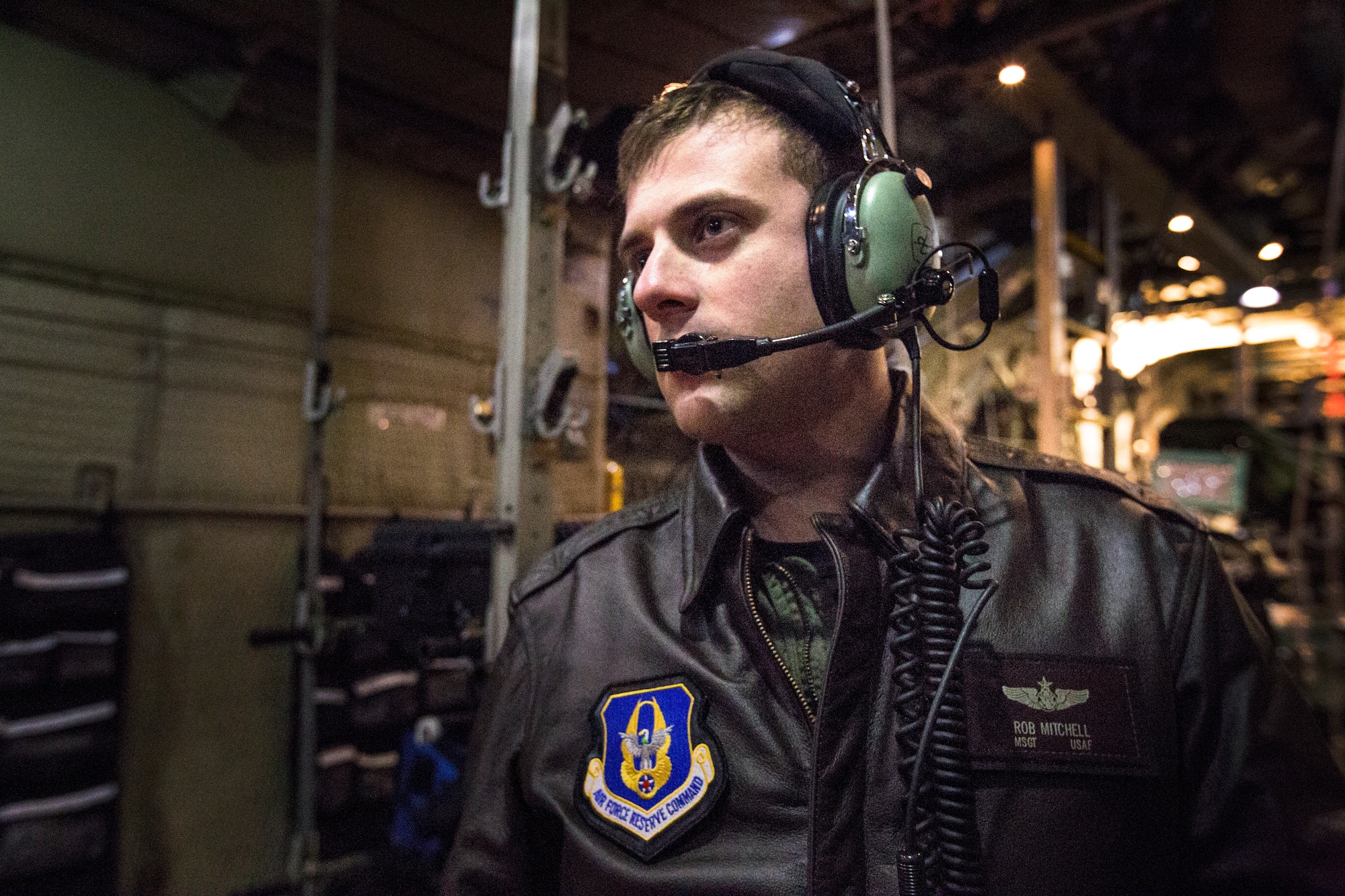 U.S. Air Force Master Sgt. Rob Mitchell, a C-130H Hercules Loadmaster with the 757th Airlift Squadron, 910th Airlift Wing, Youngstown Air Reserve Station, Ohio, monitors equipment setup by members of the 514th Aeromedical Evacuation Squadron, 514th Air Mobility Wing, prior to departure on an aeromedical evacuation training mission from Joint Base McGuire-Dix-Lakehurst, N.J., to Joint Base Charleston, S.C., Dec. 15, 2017.