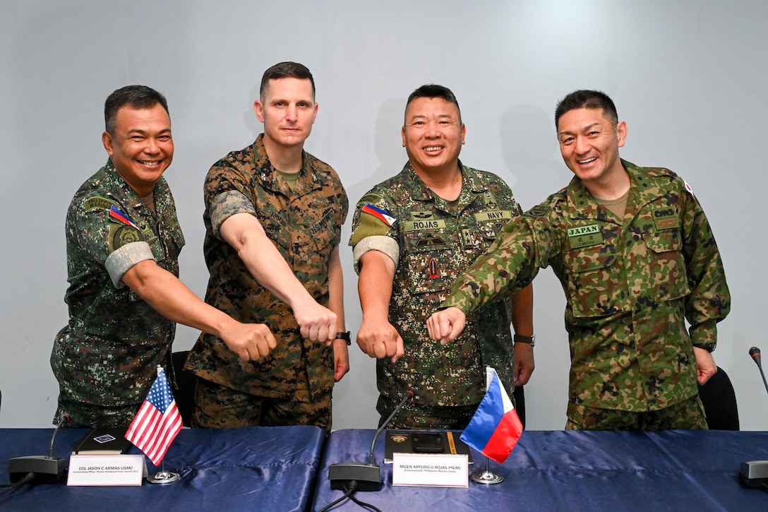 Leaders from the Philippine and U.S. Marine Corps and Japan Ground Self Defense Force pose for a photo during the KAMANDAG 9 opening ceremony at Fort Bonifacio, Manila, Philippines, May 26, 2025.